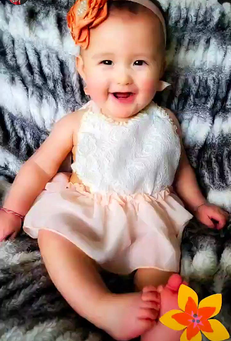 Jia joined the competition — help win amazing prizes! baby, baby_toddler_clothing, cheek, child, eye, finger, happy, human_body, human_leg, iris, joy, pattern, person, petal, pink, sitting, skin, sleeve, smile, textile