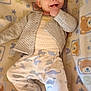 Corsen joined the competition — help win amazing prizes! baby, infant, child, blanket, teddy_bear, pajamas, jacket, dinosaur_pattern, smiling, lying_down, hand_in_mouth, cute, soft_texture, cozy, indoors, portrait, happy, face, person, sleepwear