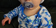 Corsen joined the competition — help win amazing prizes! toddler, child, pacifier, hat, knit_hat, blue_clothing, patterned_clothing, sitting, couch, leather, indoor, portrait, face, eyes, hand, long_sleeves, pants, baby, cute, young_child