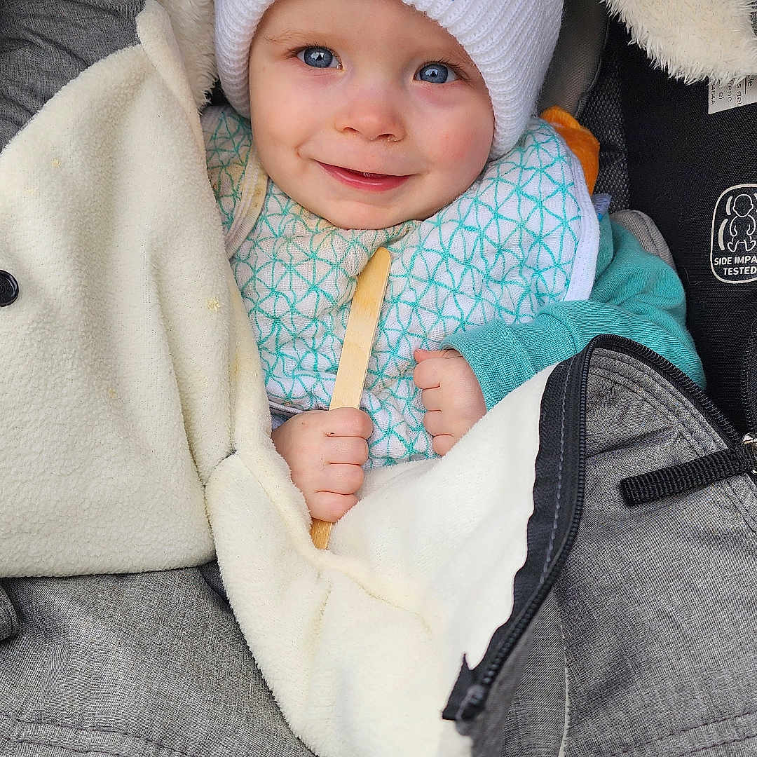 Corsen joined the competition — help win amazing prizes! baby, baby_boy, blanket, blue_eyes, bundle, child, closeup, clothing, cozy, cute, face, hat, holding, infant, portrait, smiling, stroller, warm, white_hat, wooden_stick