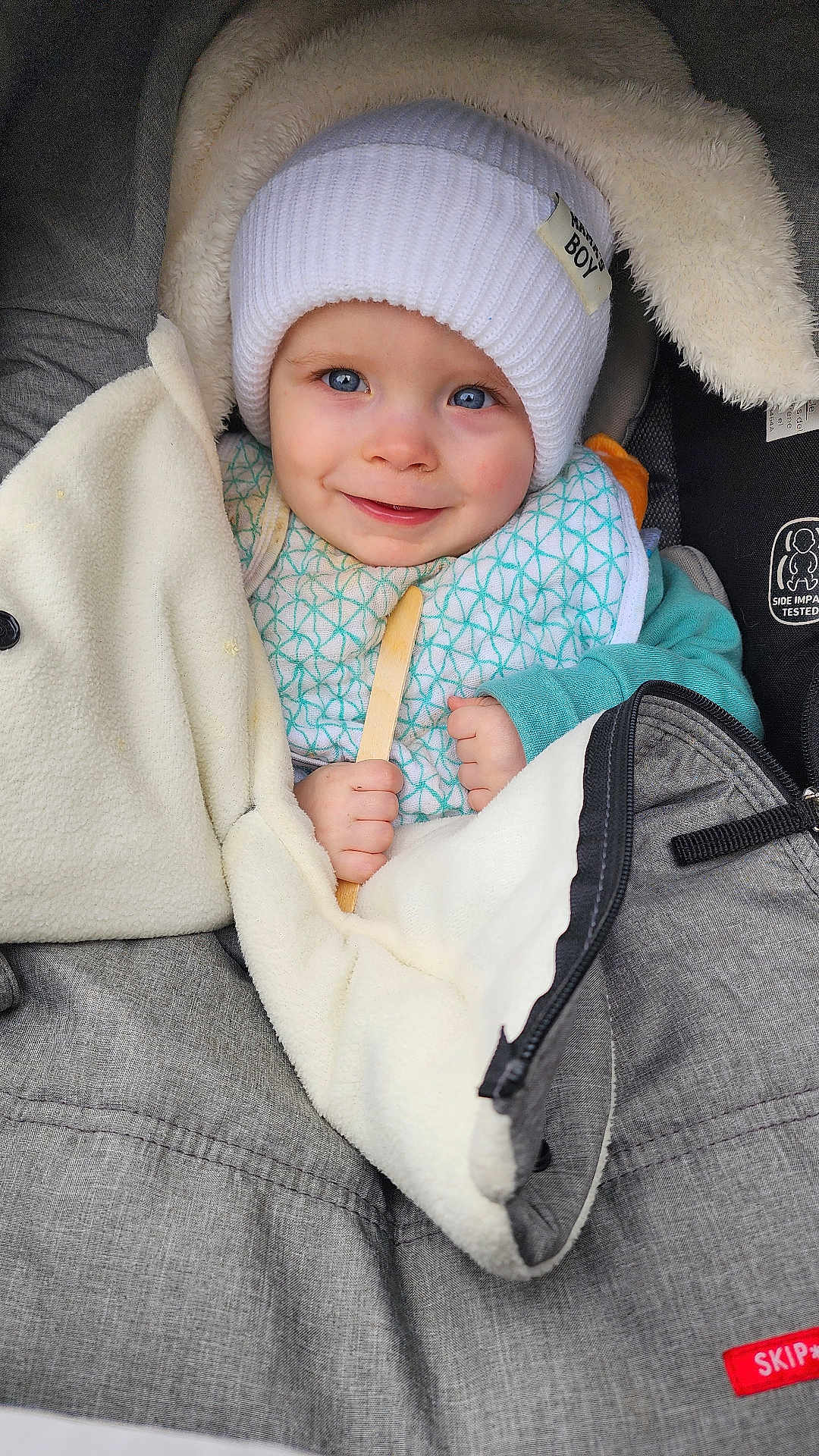 Corsen joined the competition — help win amazing prizes! baby, child, smiling, hat, white_hat, blanket, stroller, blue_eyes, holding, wooden_stick, clothing, bundle, warm, face, infant, cute, portrait, cozy, closeup, baby_boy