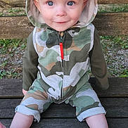 Corsen joined the competition — help win amazing prizes! baby, child, hoodie, camouflage, bench, outdoor, grass, smile, face, blue_eyes, sitting, wood, clothing, cute, portrait, legs, barefoot, young, person, nature