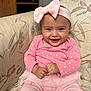 Leah joined the competition — help win amazing prizes! baby, child, smiling, pink_clothing, headband, bow, tutu, couch, indoor, happy, infant, portrait, person, sitting, cute, heart_pattern, toddler, fabric, homedecor, hands