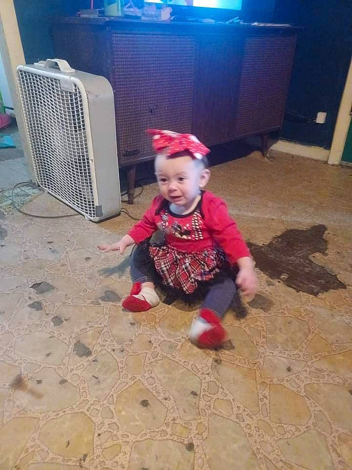 Mariana is registered to the contest to win money with this photo: baby, baby_toddler_clothing, carmine, child, floor, flooring, fun, hardwood, head, holiday, pattern, person, play, sitting, sleeve, smile, soil, t_shirt, toddler, vertebrate