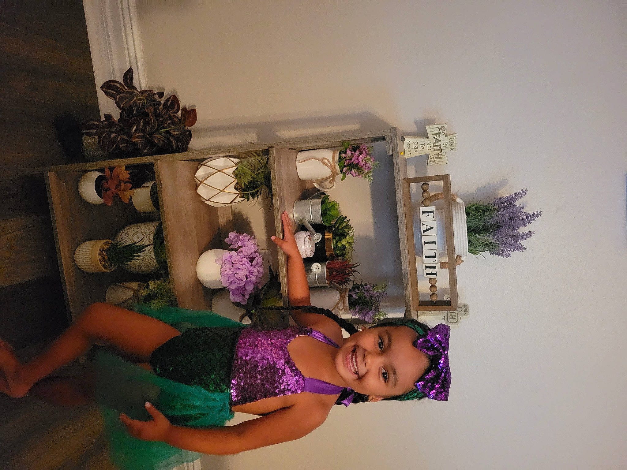 Jayden joined the competition — help win amazing prizes! curtain, fashion_design, floral_design, flower_arranging, flowerpot, happy, headwear, houseplant, joy, magenta, person, pink, plant, purple, room, shelf, shelving, smile, textile, toy