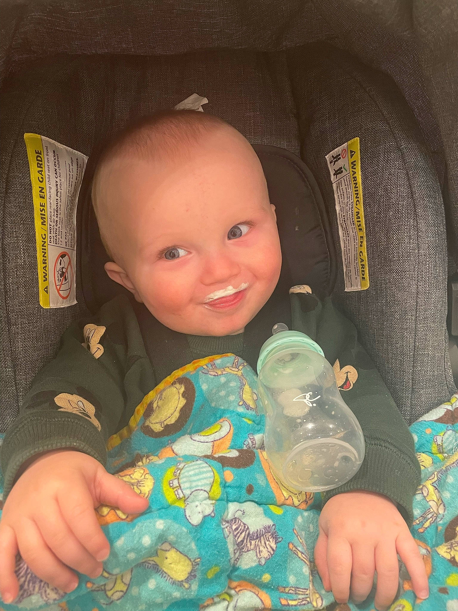 Carter is registered to the contest to win money with this photo: baby, baby_toddler_clothing, car_seat, cheek, child, comfort, finger, fun, hand, happy, head, joy, linens, nail, person, sitting, skin, sleeve, smile, textile