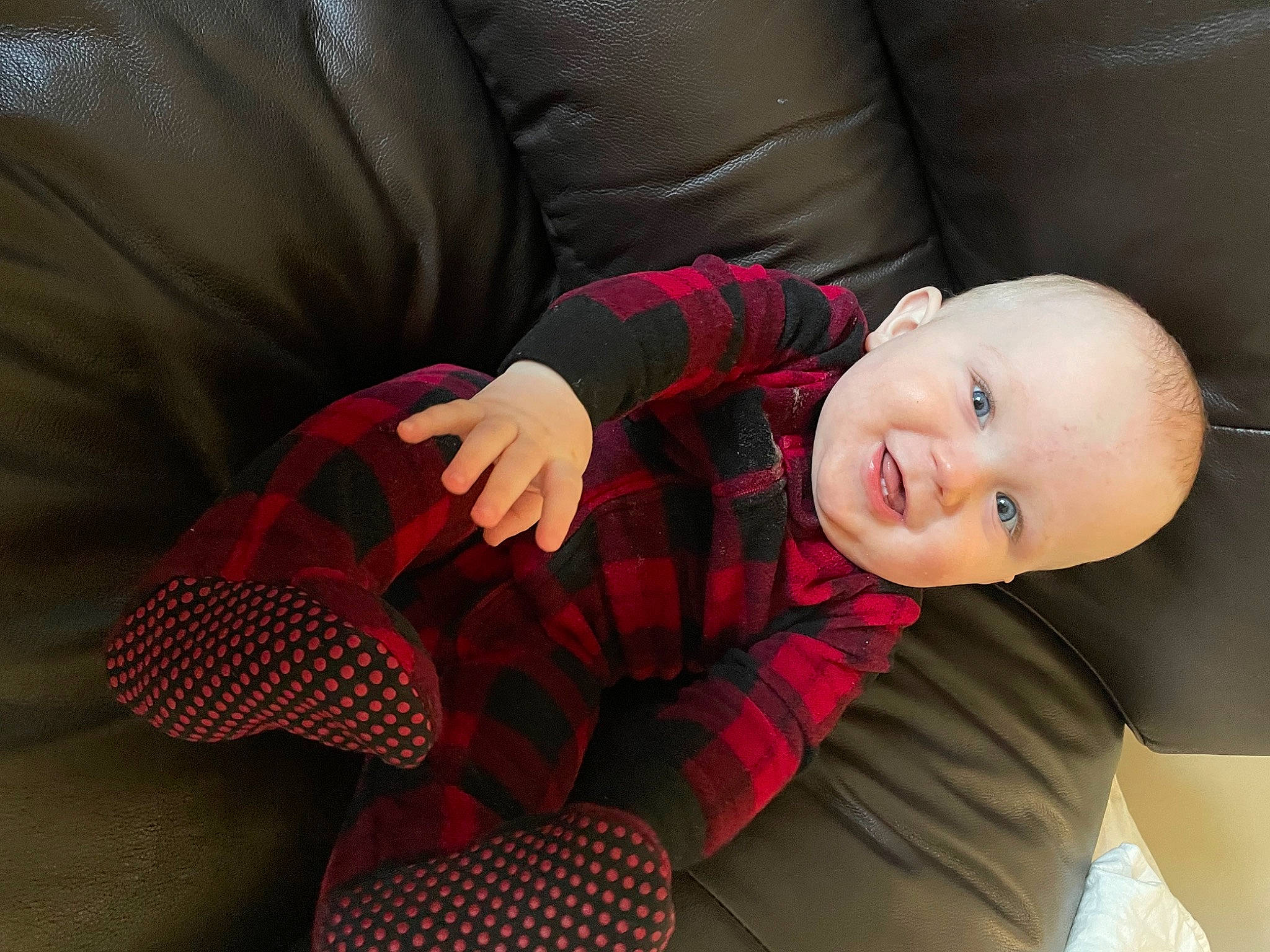 Carter is registered to the contest to win money with this photo: baby, baby_toddler_clothing, child, comfort, elbow, flash_photography, human_body, human_leg, knee, leg, mouth, pattern, person, plaid, sitting, sleeve, smile, tartan, thigh, toddler