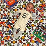 Jahmir joined the competition — help win amazing prizes! baby, infant, blanket, candy, halloween, books, child, clothing, pattern, sweet, snack, lying_down, striped_pajamas, colorful, orange, green, purple, cute, festive, holiday