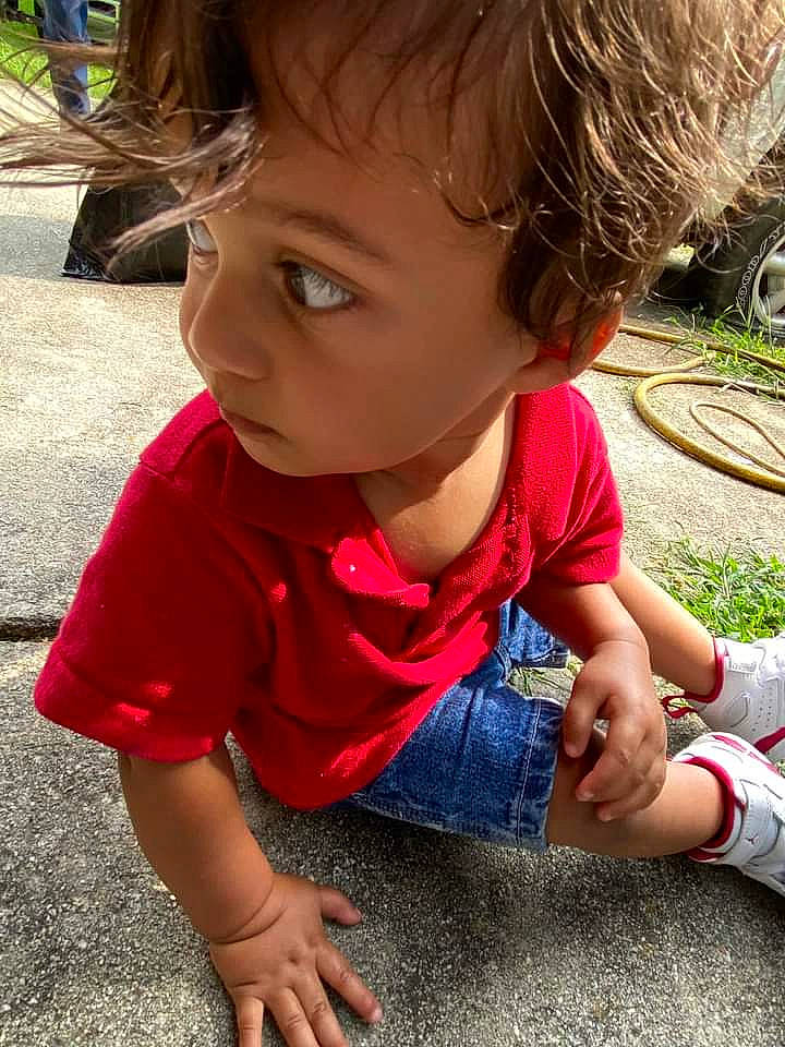 Gabriel is registered to the contest to win money with this photo: baby_toddler_clothing, cheek, child, clothing, fun, grass, hair, hairstyle, happy, leisure, nose, person, play, sand, skin, sleeve, smile, soil, t_shirt, toddler