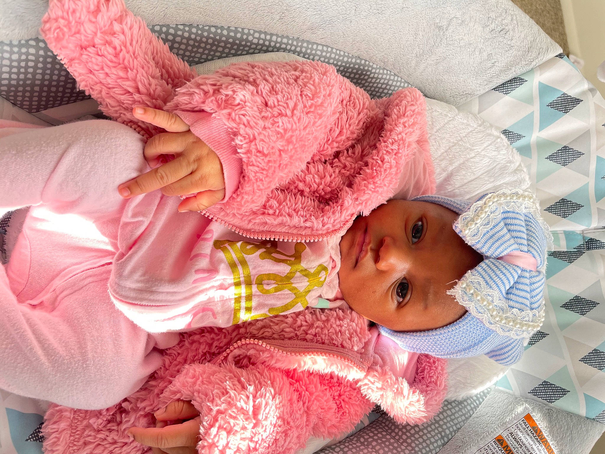 Royale is registered to the contest to win money with this photo: baby, baby_products, baby_safety, baby_sleeping, baby_toddler_clothing, cheek, child, comfort, head, linens, magenta, pattern, person, pink, product, room, skin, sleeve, textile, toddler