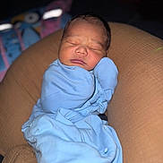 Kashton is registered to the contest to win money with this photo: newborn, baby, sleeping, blue_blanket, swaddled, infant, cushion, soft, cozy, indoors, portrait, peaceful, child, cute, resting, young, face, head, blanket, comfort