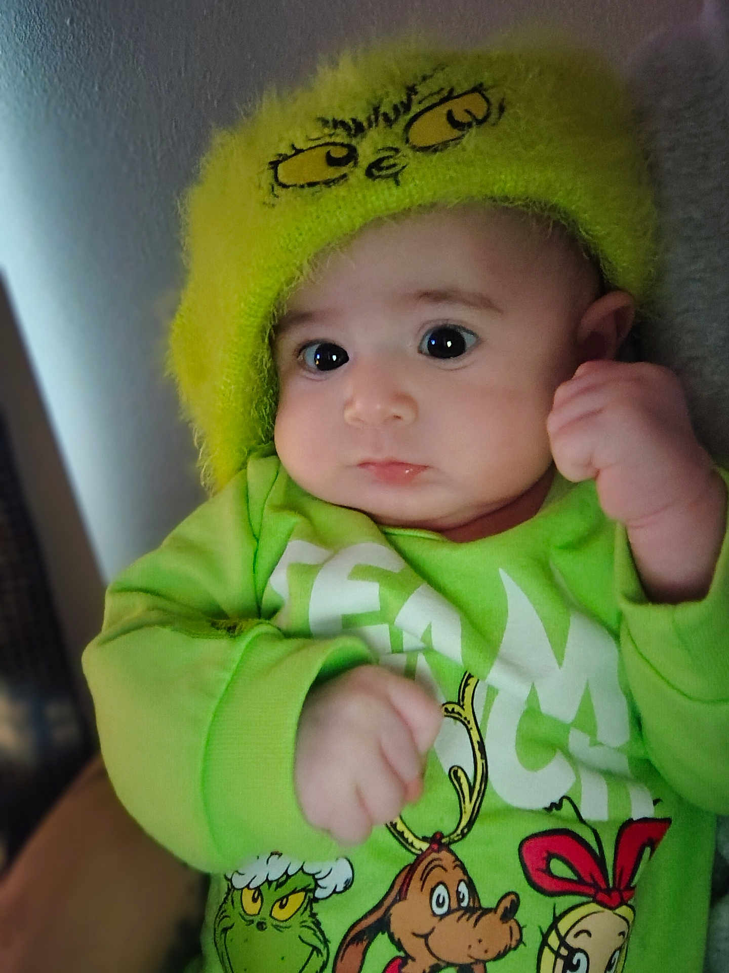 Jaliah joined the competition — help win amazing prizes! baby, child, green_hat, green_shirt, cartoon_characters, wide_eyes, clenched_fists, cute, indoor, portrait, fuzzy_hat, expression, face, person, clothing, sleeves, soft_light, closeup, infant, young_child
