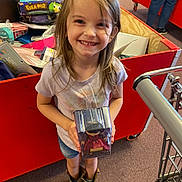 Myla is registered to the contest to win money with this photo: adult, child, clothing, face, female, food, footwear, girl, head, male, man, pants, person, photography, portrait, sandal, shoe, shorts, sweets, woman