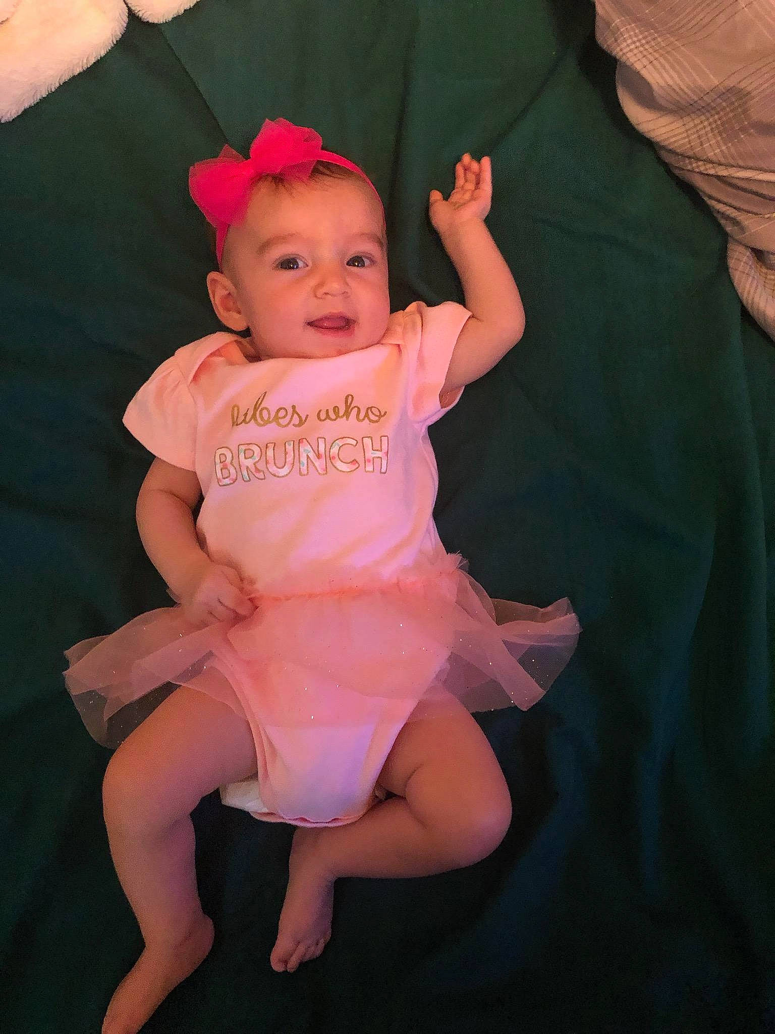 Samara is registered to the contest to win money with this photo: arm, baby, baby_toddler_clothing, ballet_tutu, child, costume, dance, finger, fun, hair_accessory, hand, headband, headgear, leg, person, pink, product, smile, toddler