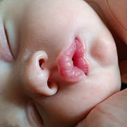 Oksana participe au concours pour gagner de l'argent avec cette photo : baby, close_up, face, sleeping, nose, lips, skin, infant, peaceful, soft_light, mouth, cheek, eyelashes, sleep, cute, human, newborn, portrait, rest, toddler