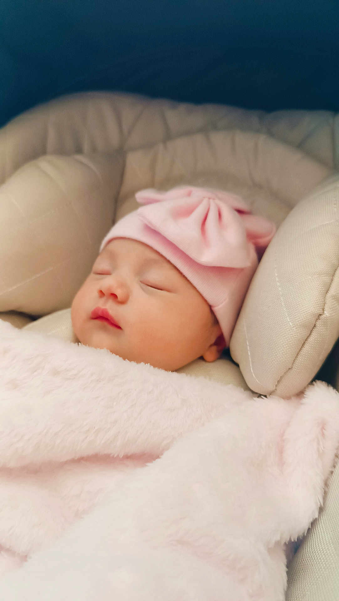 Oksana participe au concours pour gagner de l'argent avec cette photo : baby, sleeping, pink_hat, pink_blanket, cushion, soft_texture, infant, peaceful, child, closeup, headwear, resting, cozy, blanket, cute, portrait, indoors, face, newborn, comfort