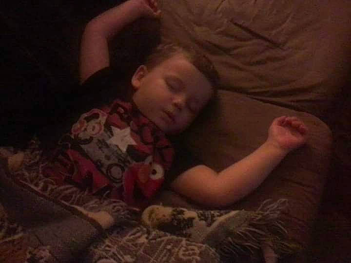 Bentley is registered to the contest to win money with this photo: bedding, bedtime, cloud, comfort, darkness, elbow, finger, flash_photography, flooring, gesture, human_leg, linens, long_hair, mammal, mouth, person, room, sitting, sleeve, tints_and_shades