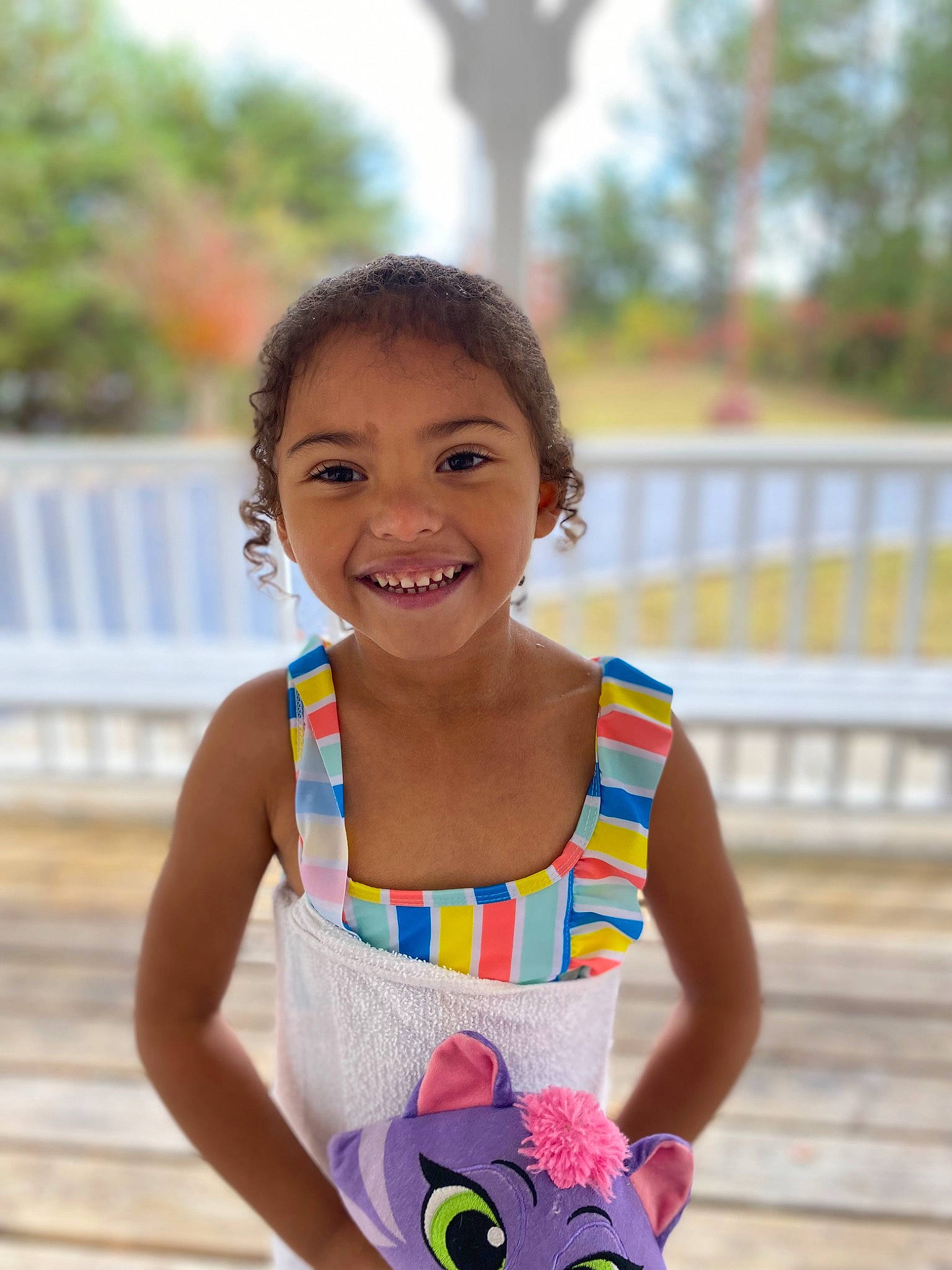 Gwendolyn is registered to the contest to win money with this photo: abdomen, event, fun, happy, jewellery, joy, leisure, pattern, person, play, recreation, sitting, skin, sleeveless_shirt, smile, summer, t_shirt, toddler, toy, travel