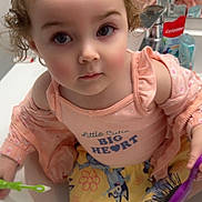 Adelaide joined the competition — help win amazing prizes! child, toddler, bathroom, sink, toothbrush, hairbrush, mirror, curly_hair, clothing, sneakers, reflection, cute, pink, yellow, patterned_skirt, person, face, indoor, playful, curious
