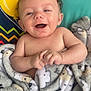 animal_print, baby, blanket, child, colorful, comfort, cozy, cute, face, hands, happy, indoors, infant, pattern, playmat, portrait, skin, smiling, soft, young