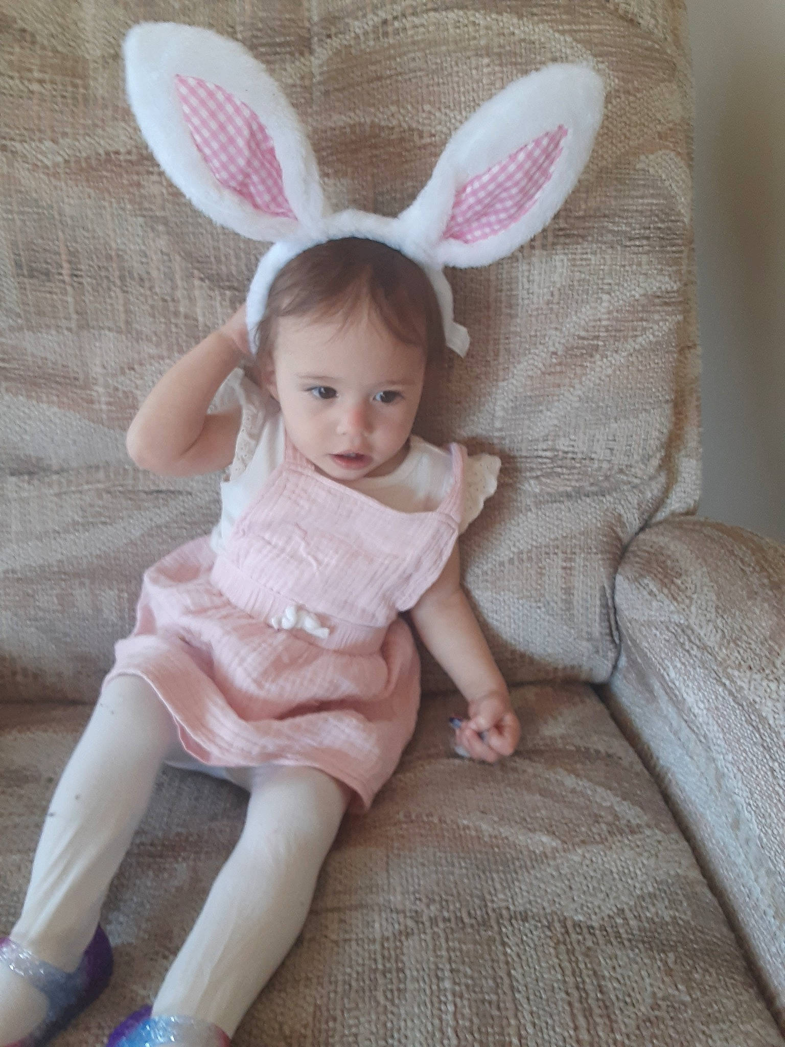 Noel is registered to the contest to win money with this photo: arm, baby_toddler_clothing, cheek, dress, ear, eye, face, hand, happy, head, human_body, iris, leg, mammal, mythical_creature, person, pink, skin, sleeve, textile