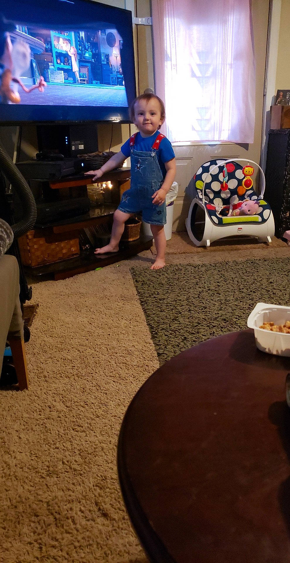 Gannon joined the competition — help win amazing prizes! carpet, chair, child, floor, flooring, fun, furniture, leg, living_room, person, play, room, sitting, table, toddler