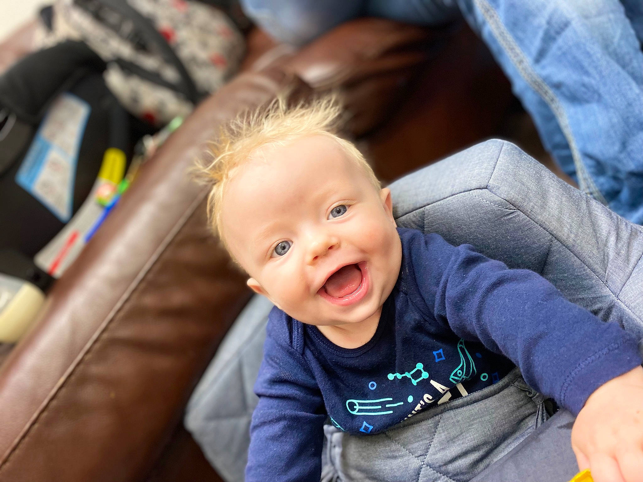 Ryker joined the competition — help win amazing prizes! auto_part, baby, baby_products, baby_toddler_clothing, blond, child, comfort, couch, eye, flash_photography, fun, grass, happy, leg, leisure, person, sitting, skin, smile, t_shirt