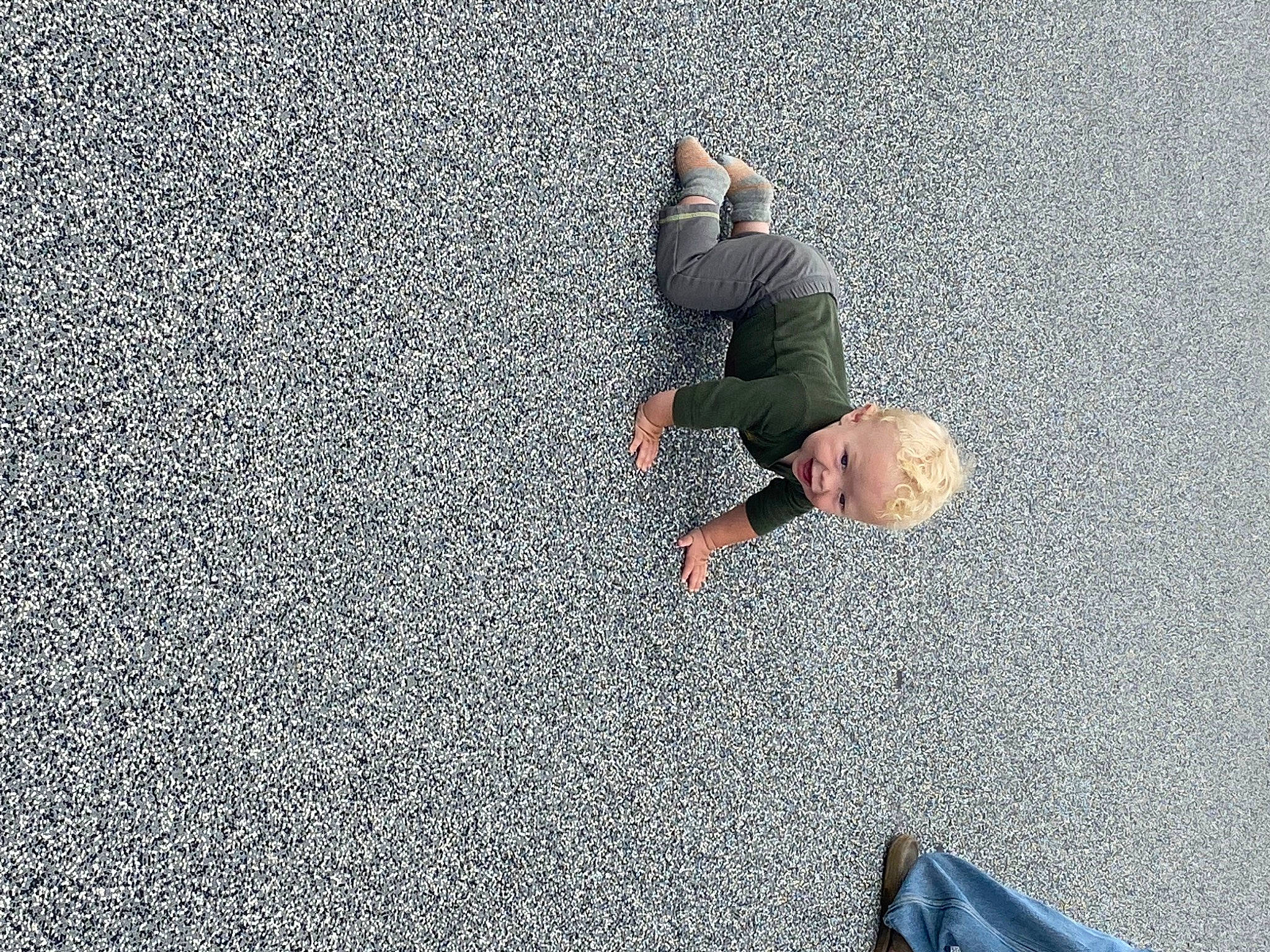 Ryker is registered to the contest to win money with this photo: asphalt, bag, city, cobblestone, concrete, flooring, fun, gesture, grass, grey, human_leg, landscape, person, recreation, road, road_surface, sand, shadow, sidewalk, sitting