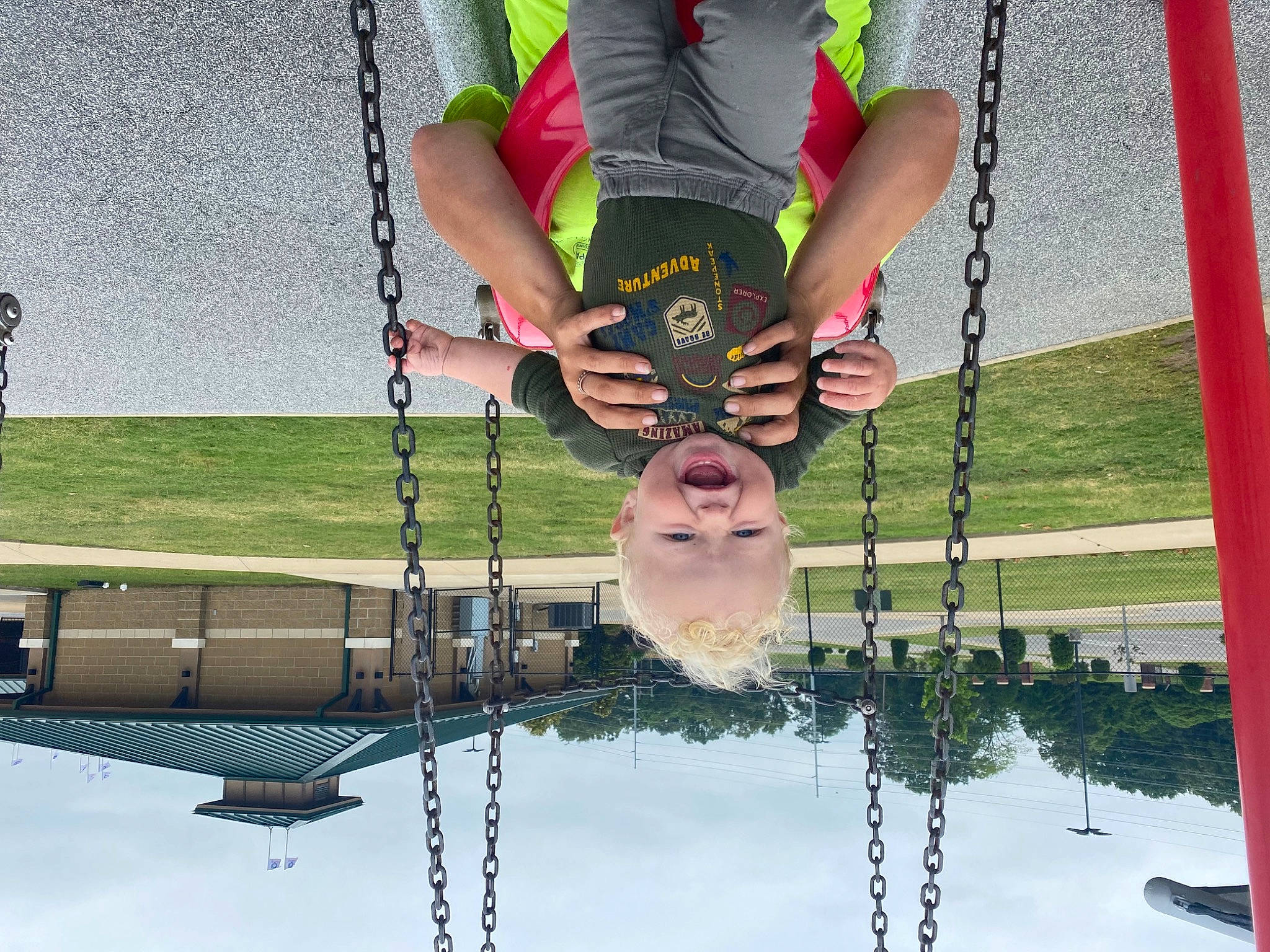 Ryker is registered to the contest to win money with this photo: circle, elbow, fun, grass, happy, human_body, human_leg, knee, leisure, line, pattern, person, photograph, pole, recreation, rope, shorts, symmetry, thigh, waist