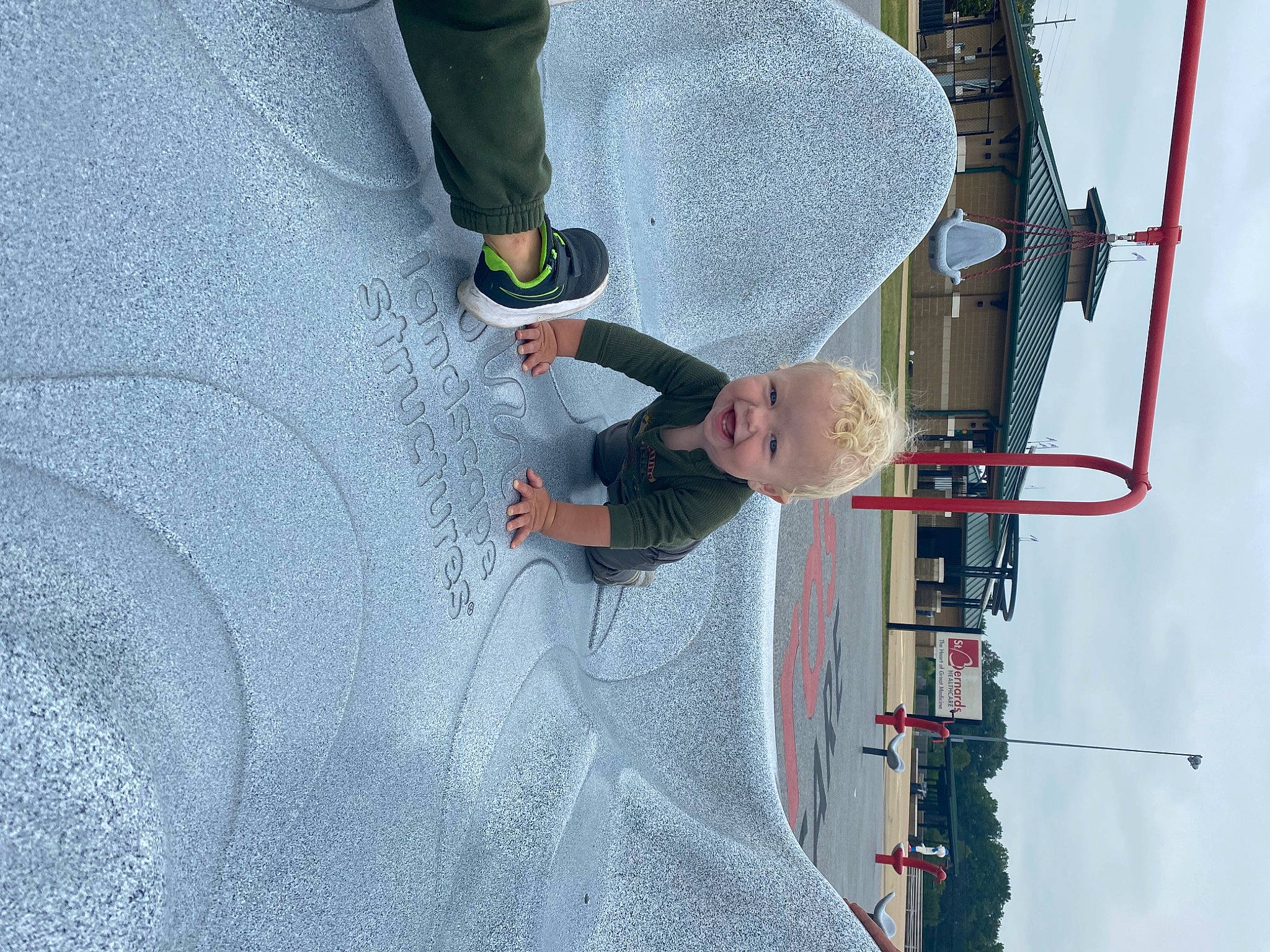 Ryker is registered to the contest to win money with this photo: asphalt, automotive_tire, concrete, electrical_supply, electrical_wiring, electricity, fun, human_leg, pattern, pedestrian, person, public_utility, recreation, road_surface, sky, street_light, walking_shoe, wire