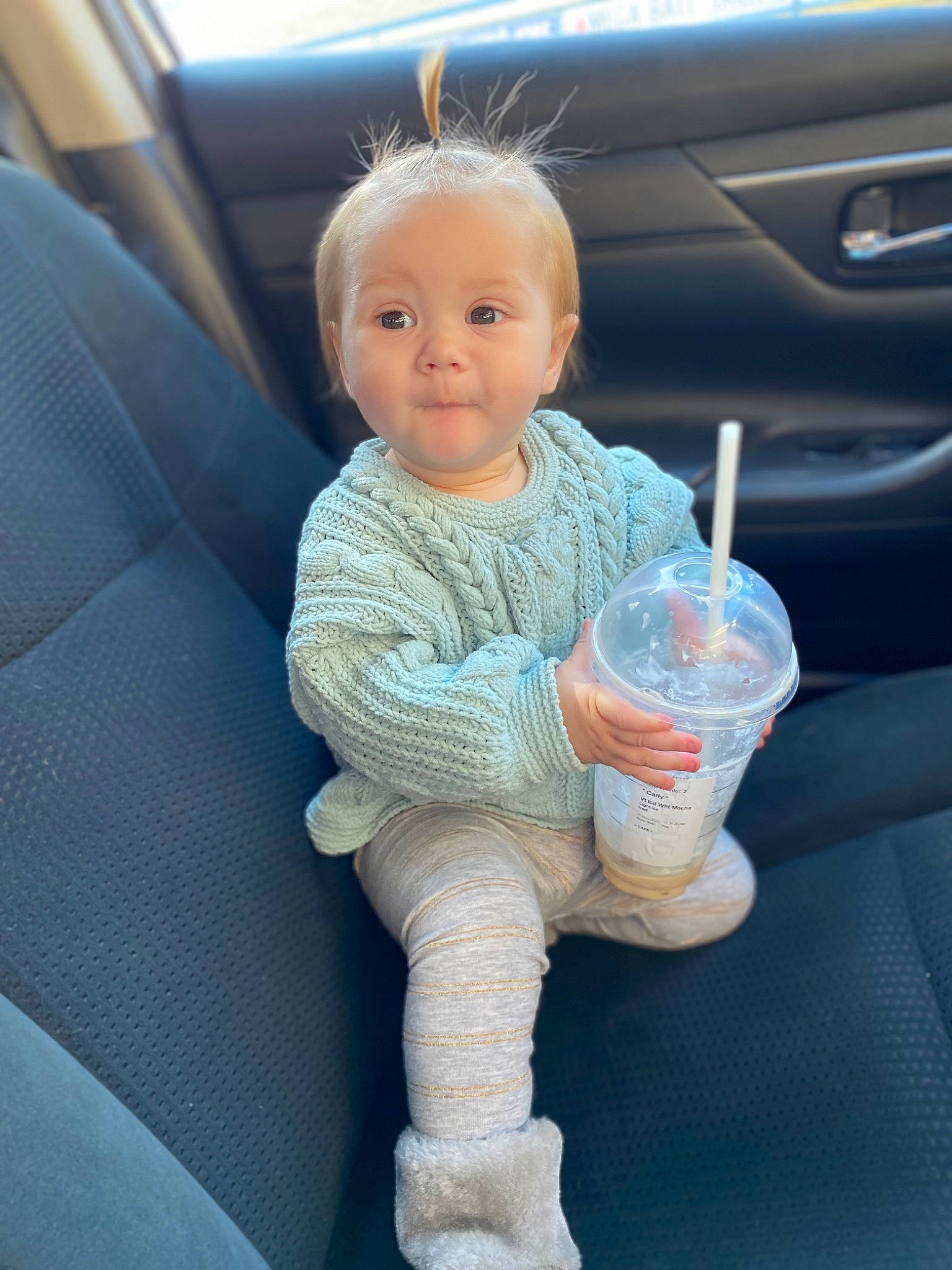 Everleigh joined the competition — help win amazing prizes! arm, auto_part, automotive_design, automotive_exterior, azure, baby_toddler_clothing, car_seat, comfort, drinking_water, drinkware, electric_blue, finger, gesture, hand, person, plastic_bottle, skin, steering_wheel, thumb, toddler