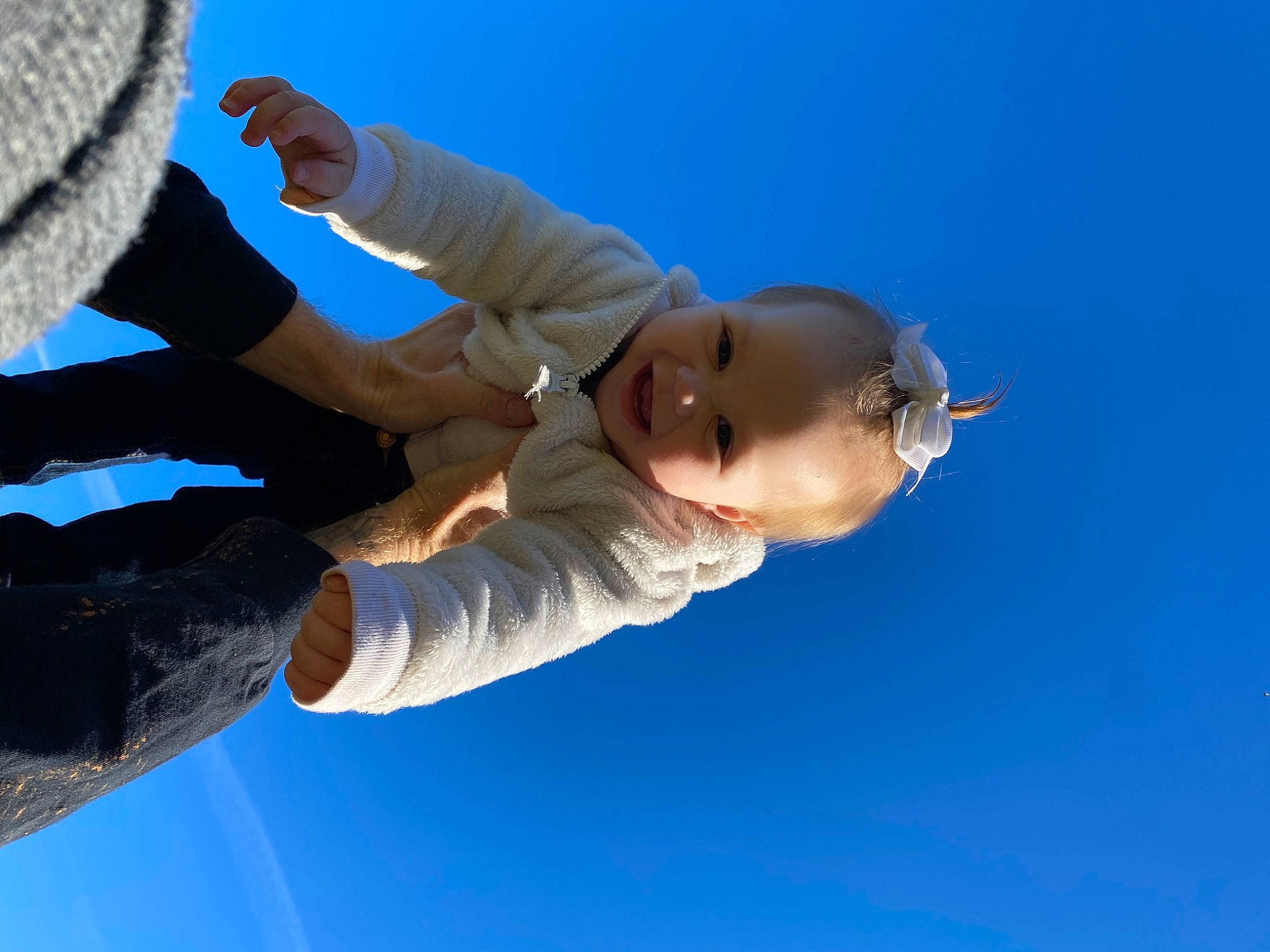 Everleigh is registered to the contest to win money with this photo: cloud, elbow, electric_blue, flash_photography, fun, gesture, glove, happy, joy, leisure, people_in_nature, person, recreation, sky, smile, toddler