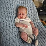 Jadeyn joined the competition — help win amazing prizes! baby, infant, blanket, knitted_blanket, onesie, socks, sleeping, person, newborn, home, furniture, wood, carpet, couch, cozy, cute, toddler, resting, indoors, soft