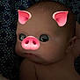 baby, infant, face_filter, pig_filter, ears, snout, cute, lying_down, patterned_blanket, skin, head, expression, indoors, child, portrait, young, playful, digital_effect, closeup, adorable