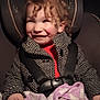 Makenna joined the competition — help win amazing prizes! baby, bodypart, car, car_interior, clothing, coat, cushion, face, finger, hand, happy, head, homedecor, jacket, person, photography, portrait, smile, transportation, vehicle