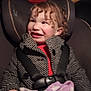 Makenna is registered to the contest to win money with this photo: accessories, baby, belt, bodypart, car, car_interior, carseat, clothing, coat, cushion, face, happy, head, homedecor, jacket, person, photography, portrait, transportation, vehicle