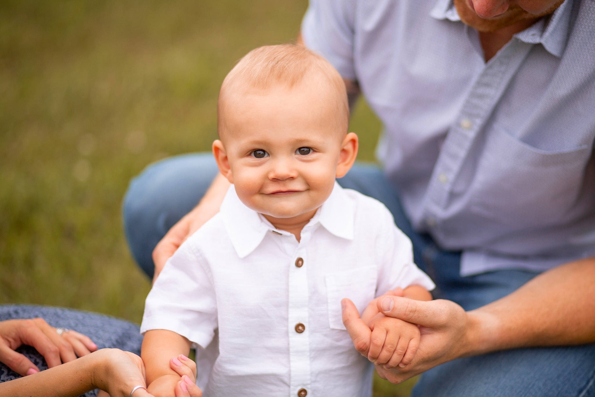 Oaklen is registered to the contest to win money with this photo: arm, child, facial_expression, finger, flash_photography, gesture, grass, hairstyle, hand, happy, human, interaction, joy, people, people_in_nature, person, photograph, product, skin, smile