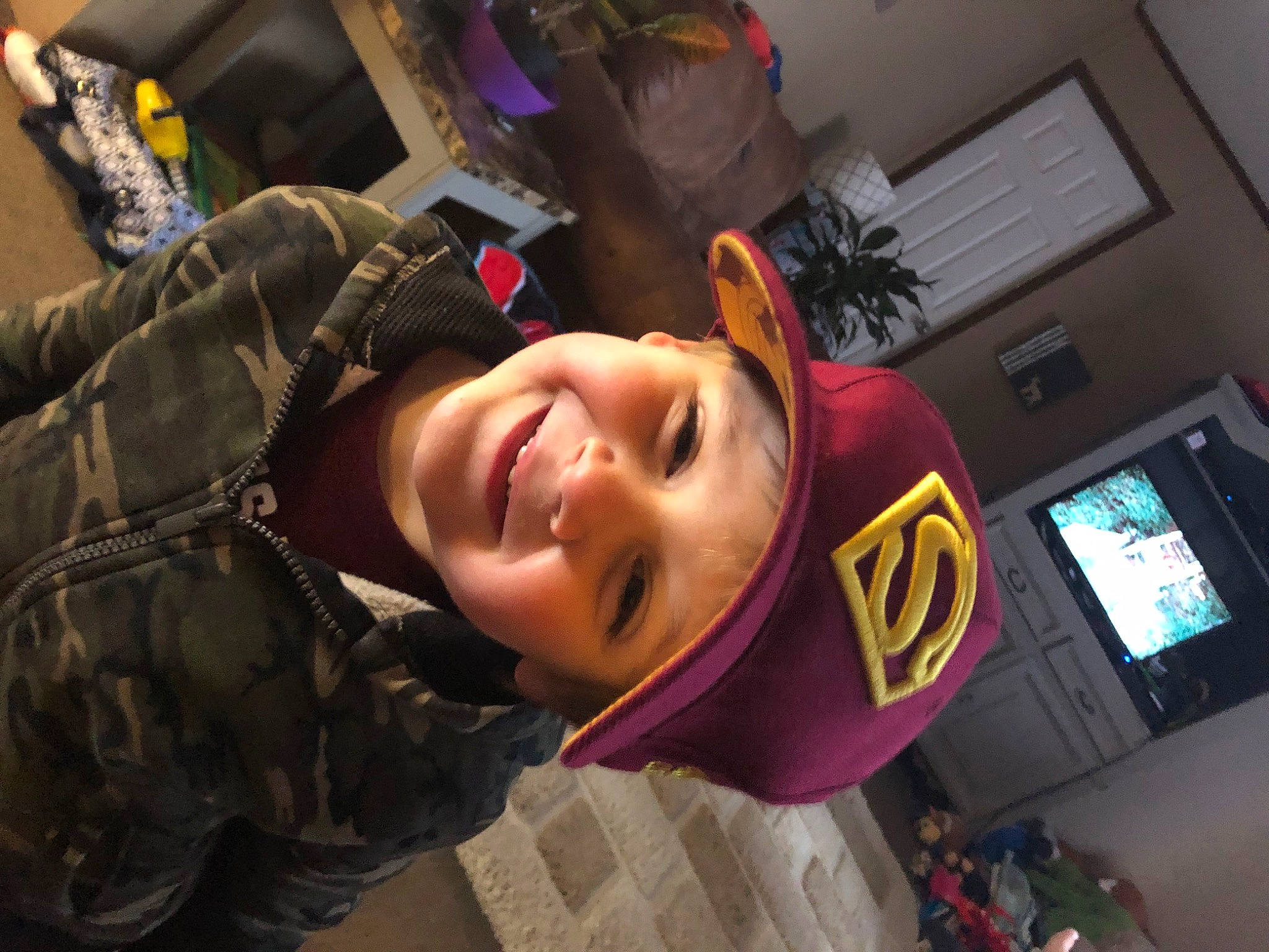 Jaxon is registered to the contest to win money with this photo: audio_equipment, black_hair, child, eyebrow, eyewear, fashion_accessory, fun, happy, headgear, headwear, joy, mouth, person, personal_protective_equipment, room, selfie, smile, toddler