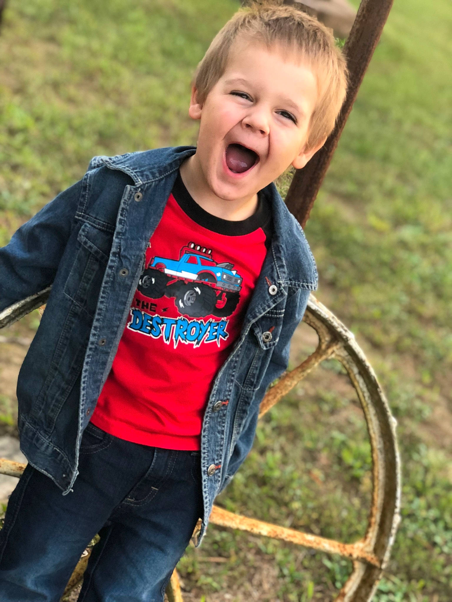 Jaxon is registered to the contest to win money with this photo: blond, child, denim, flash_photography, fun, grass, grass_family, grassland, happy, hula_hoop, leisure, people_in_nature, person, portrait_photography, recreation, sitting, sleeve, smile, soil, t_shirt