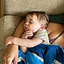 Willie is registered to the contest to win money with this photo: toddler, sleeping, child, blanket, couch, arm, hand, face, nap, rest, comfort, corduroy, person, indoor, clothing, cute, peaceful, relaxation, family, skin