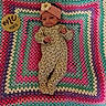 baby, infant, headband, flower, onesie, crocheted_blanket, colorful_blanket, wooden_sign, milestone, one_month, lying_down, cute, portrait, child, newborn, patterned_clothing, pink, purple, green, yellow
