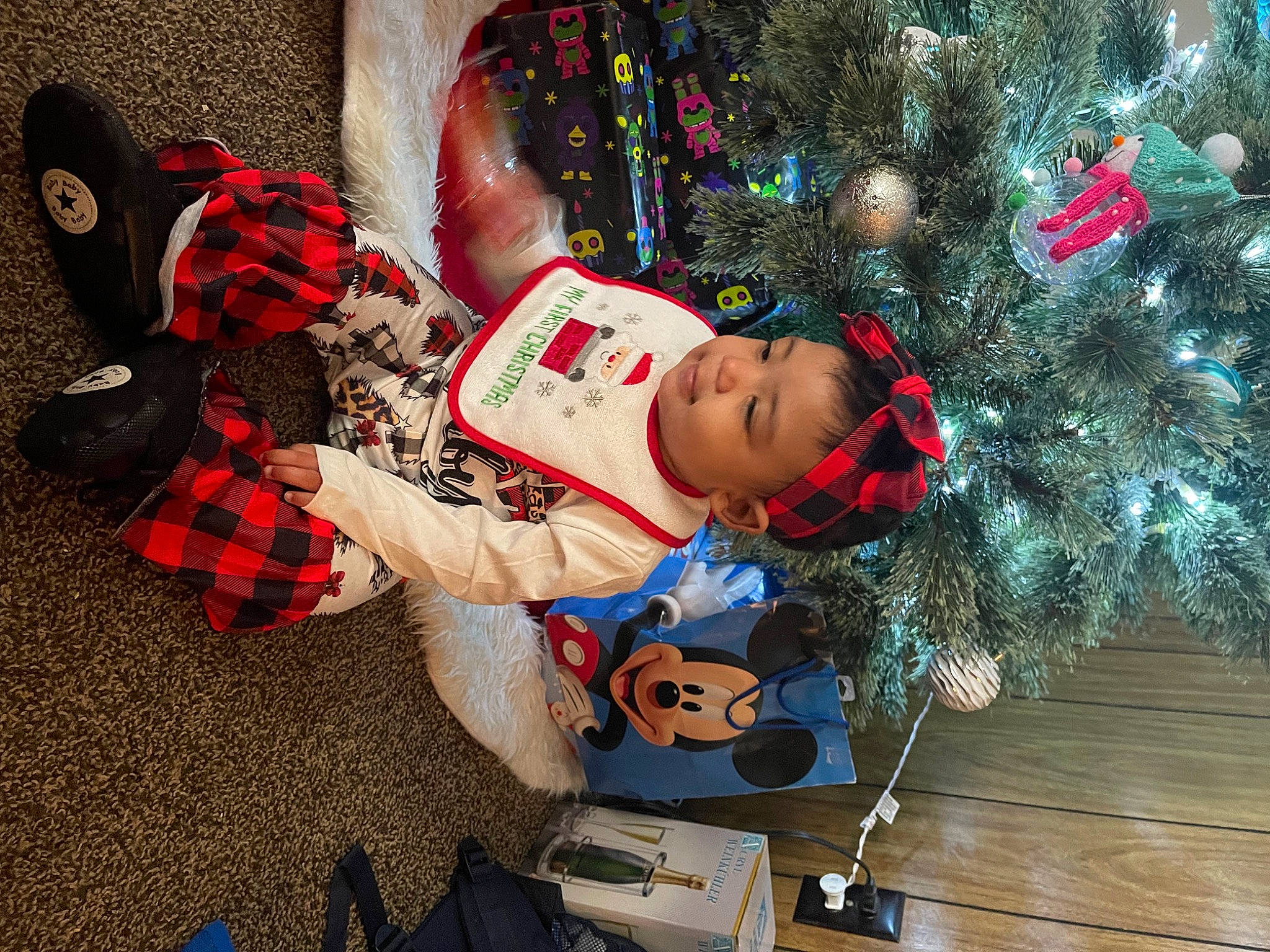 Aniya is registered to the contest to win money with this photo: carmine, christmas, christmas_decoration, christmas_ornament, christmas_tree, conifer, event, evergreen, fun, happy, holiday, holiday_ornament, lap, ornament, pattern, person, plant, tartan, toddler, tree
