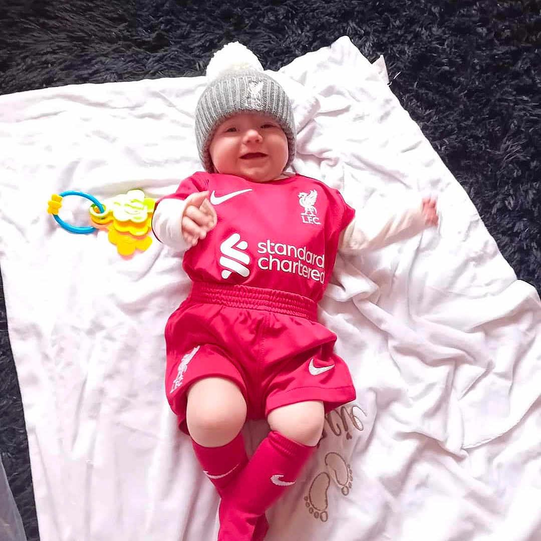 Darcie is registered to the contest to win money with this photo: baby, babylaughing, bed, blanket, clothing, face, furniture, happy, hat, head, hosiery, newborn, person, photography, portrait, sleeping, sleeve, smile, sock, yawning