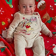 Luan joined the competition — help win amazing prizes! baby, blanket, child, christmas, cozy, cute, festive, happy, holiday, indoors, infant, pajamas, portrait, red, reindeer, santa_claus, seated, smiling, snowflakes, winnie_the_pooh