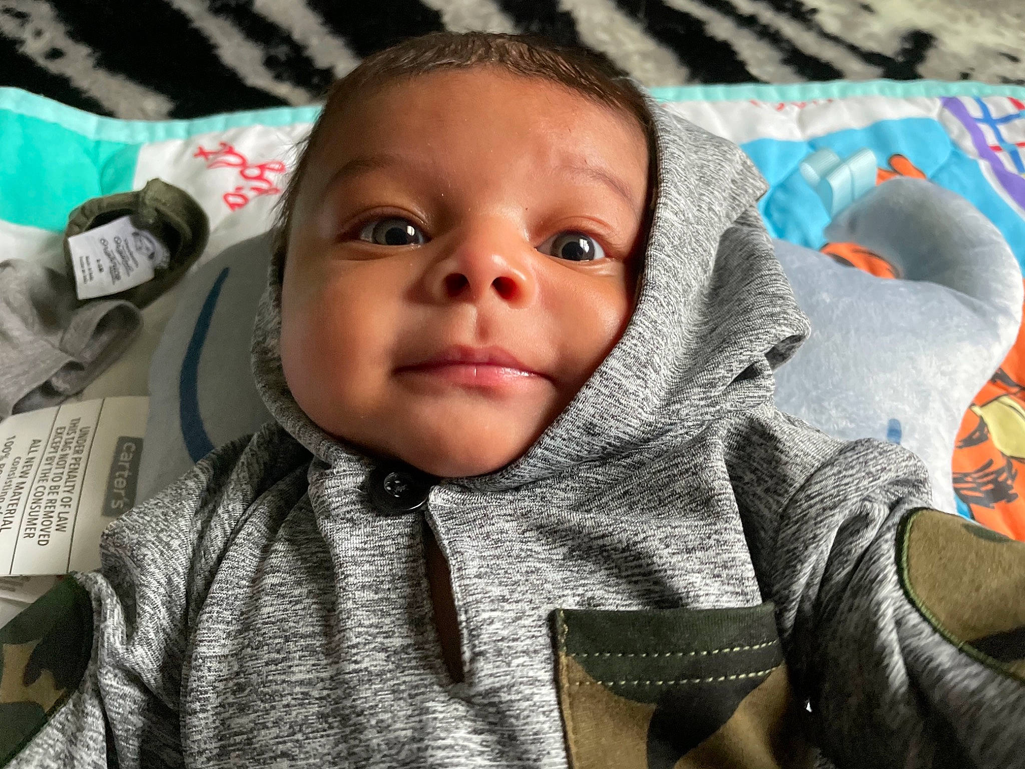 Axton is registered to the contest to win money with this photo: baby, cheek, comfort, ear, eye, eyebrow, eyelash, face, finger, forehead, hair, head, iris, lip, mouth, nose, organ, person, product, skin