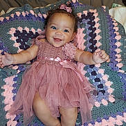 Ivee Grace joined the competition — help win amazing prizes! baby, infant, smiling, dress, pink, blanket, crochet, happy, child, laying, cute, toddler, portrait, blue_eyes, hair_bow, fabric, soft, home, cozy, arms_outstretched