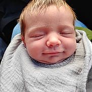 Rythym joined the competition — help win amazing prizes! baby, blanket, blond_hair, child, close_up, closed_eyes, face, gray_blanket, head, indoors, infant, newborn, peaceful, photography, portrait, sleeping, smiling, soft_lighting, swaddled, textile