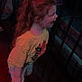 child, curly_hair, yellow_shirt, metal_railing, neon_lights, indoor, person, profile_view, excitement, standing, casual_clothing, long_hair, red_boots, dark_background, colorful_lighting, playful, young_child, smiling, side_view, fun