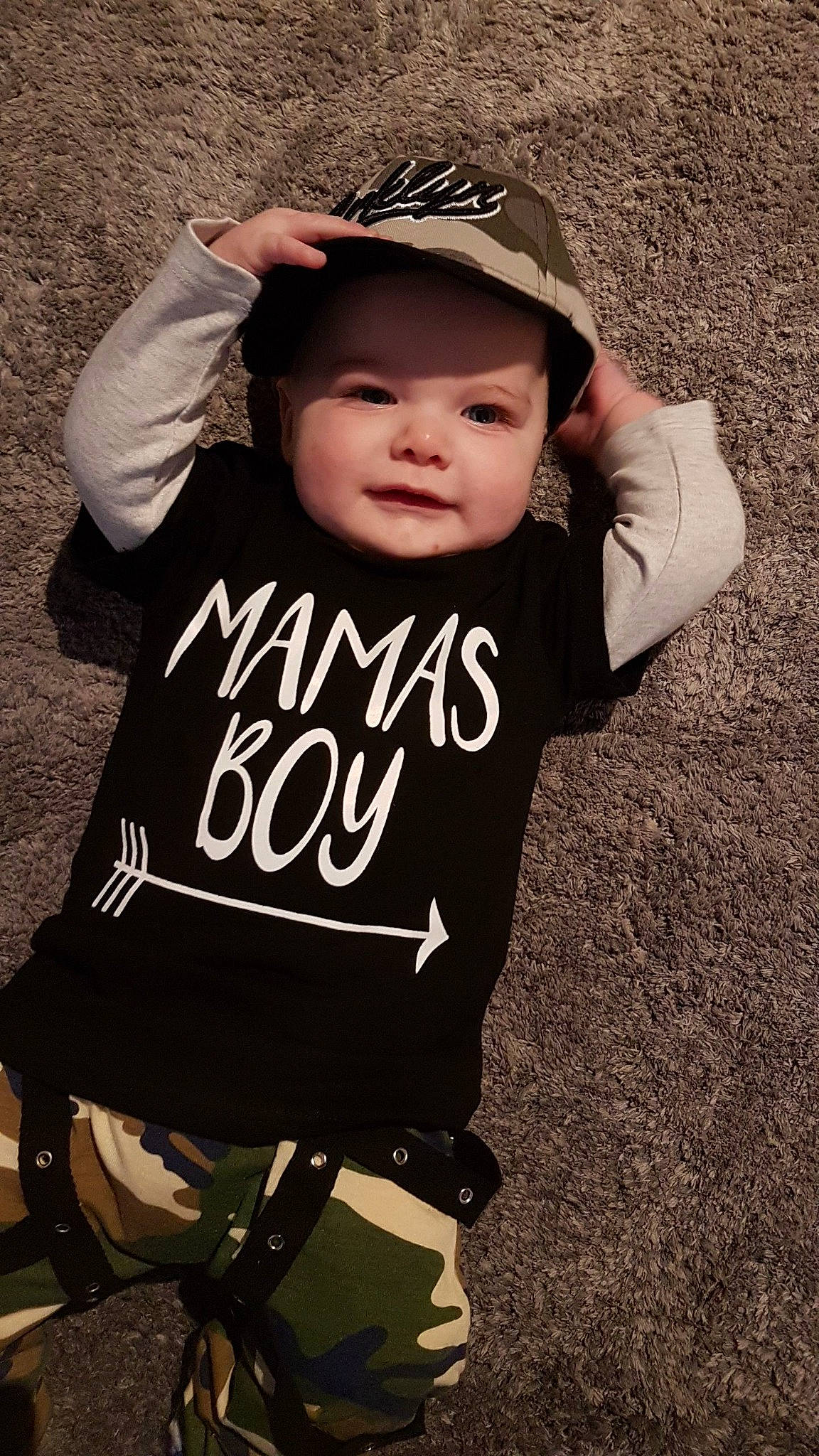 Cruz is registered to the contest to win money with this photo: baby, baby_toddler_clothing, child, cool, hat, headgear, outerwear, person, product, sleeve, smile, t_shirt, toddler