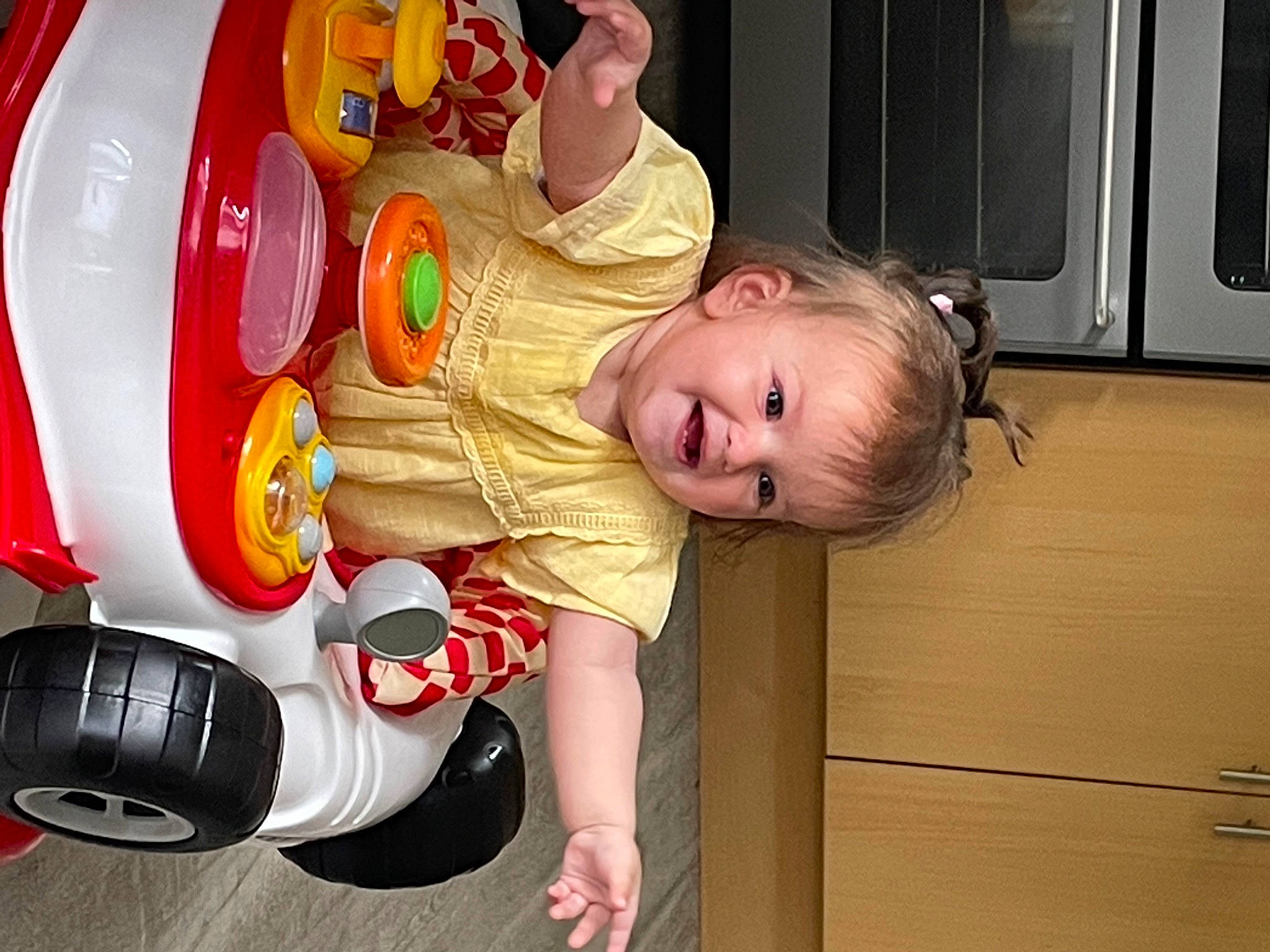 Maisy is registered to the contest to win money with this photo: baby, baby_products, baby_toddler_clothing, baby_toys, child, flooring, fun, happy, organ, person, personal_protective_equipment, pink, play, product, room, sitting, smile, sports_gear, toddler, toy